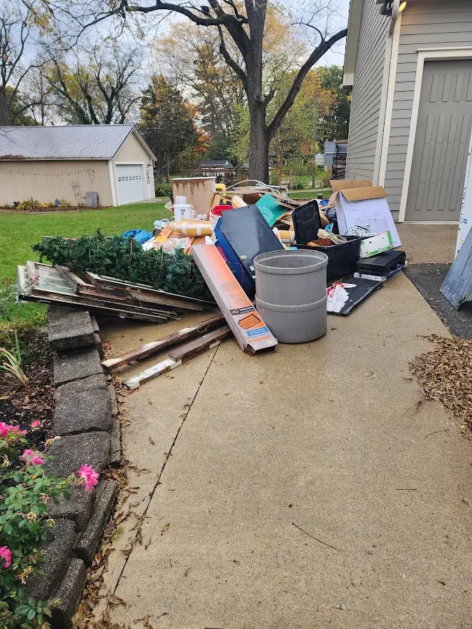 Dumpster being loaded with debris for 30 Yard Dumpster Rental in Gouverneur